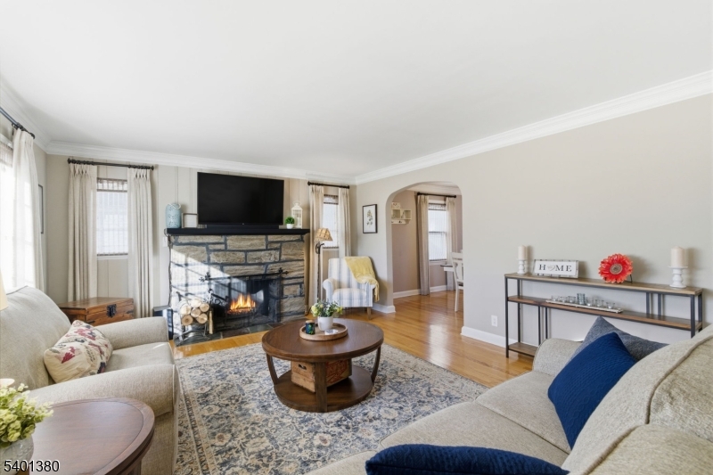 107 Chestnut Street Bound Brook, NJ 08805 - Photo 5 of 24 a living room with furniture and a flat screen tv