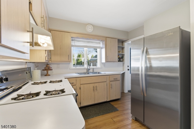 107 Chestnut Street Bound Brook, NJ 08805 - Photo 9 of 24 a kitchen with kitchen island a sink stove and refrigerator