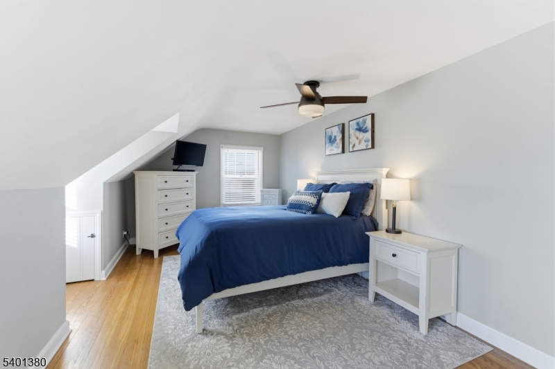 107 Chestnut Street Bound Brook, NJ 08805 - Photo 10 of 24 a spacious bedroom with a bed and a night stand