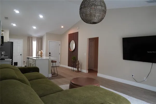 a room with wooden floor and window