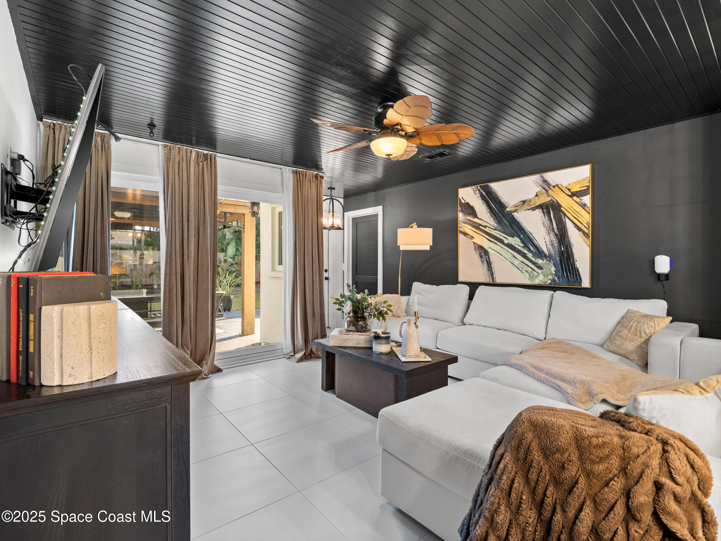 219 Sand Pine Road Indialantic, FL 32903 - Photo 14 of 38 a bedroom with furniture and a large window