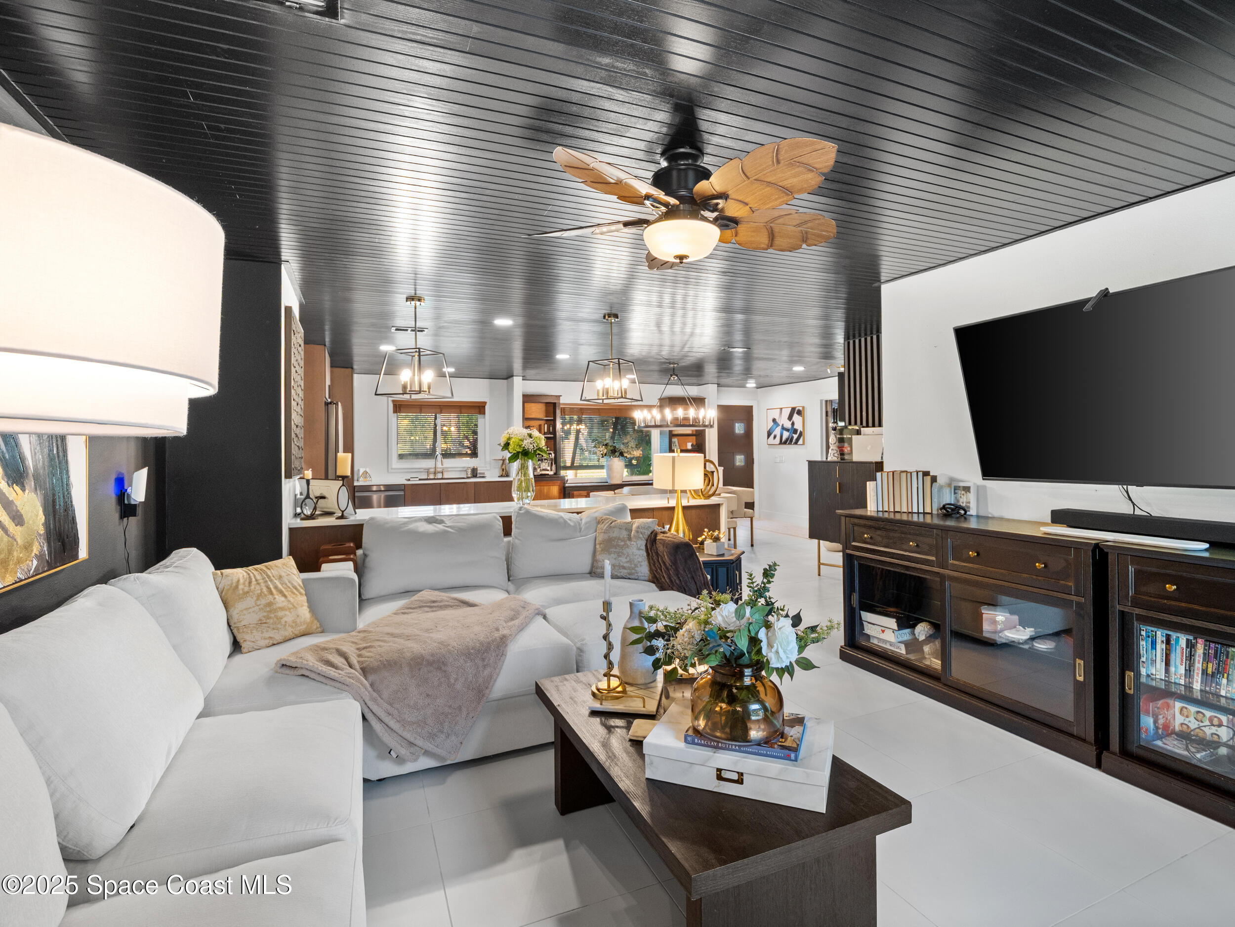 219 Sand Pine Road Indialantic, FL 32903 - Photo 15 of 38 a living room with furniture and a flat screen tv