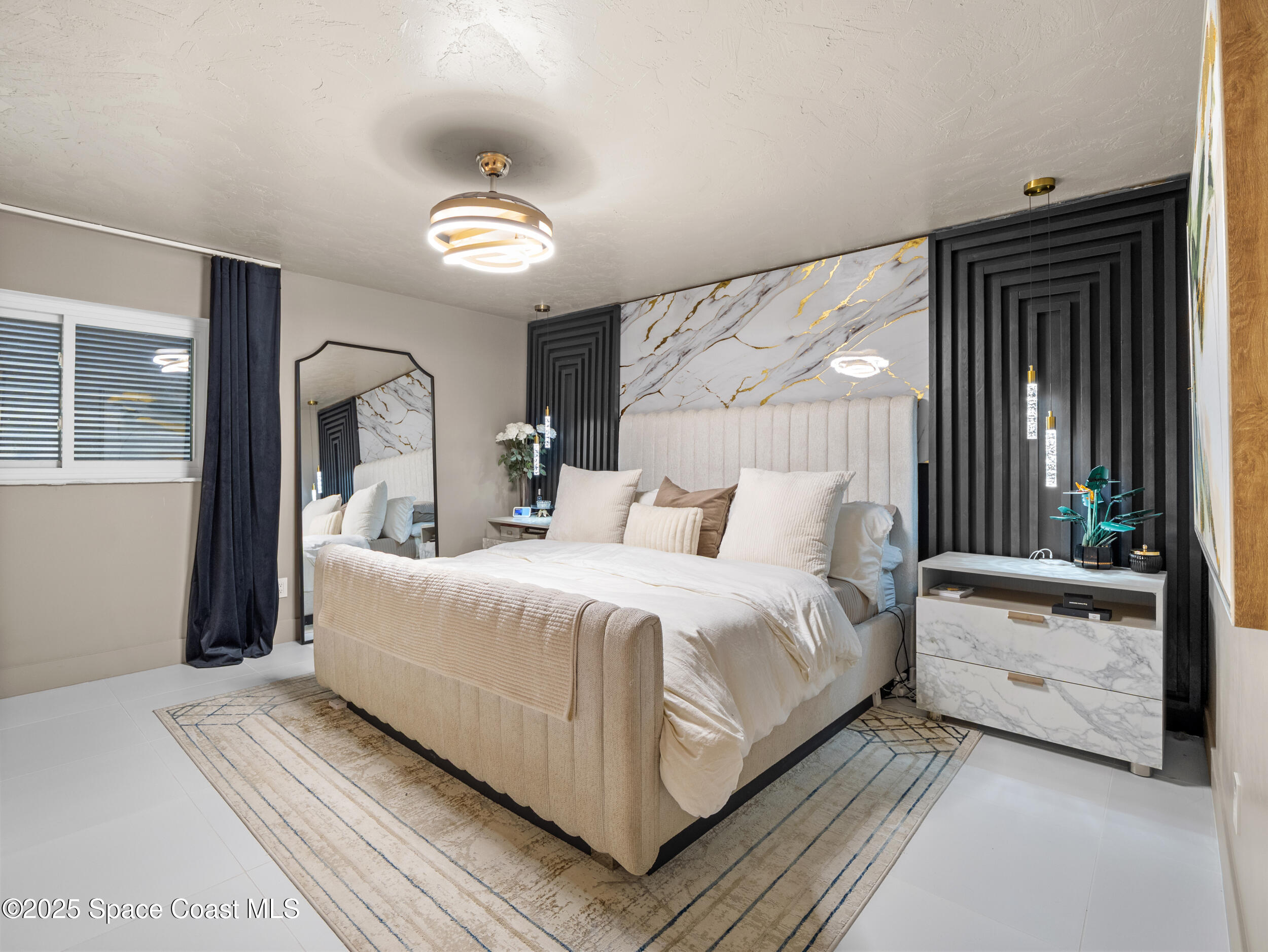 219 Sand Pine Road Indialantic, FL 32903 - Photo 17 of 38 a bedroom with a large bed and a window