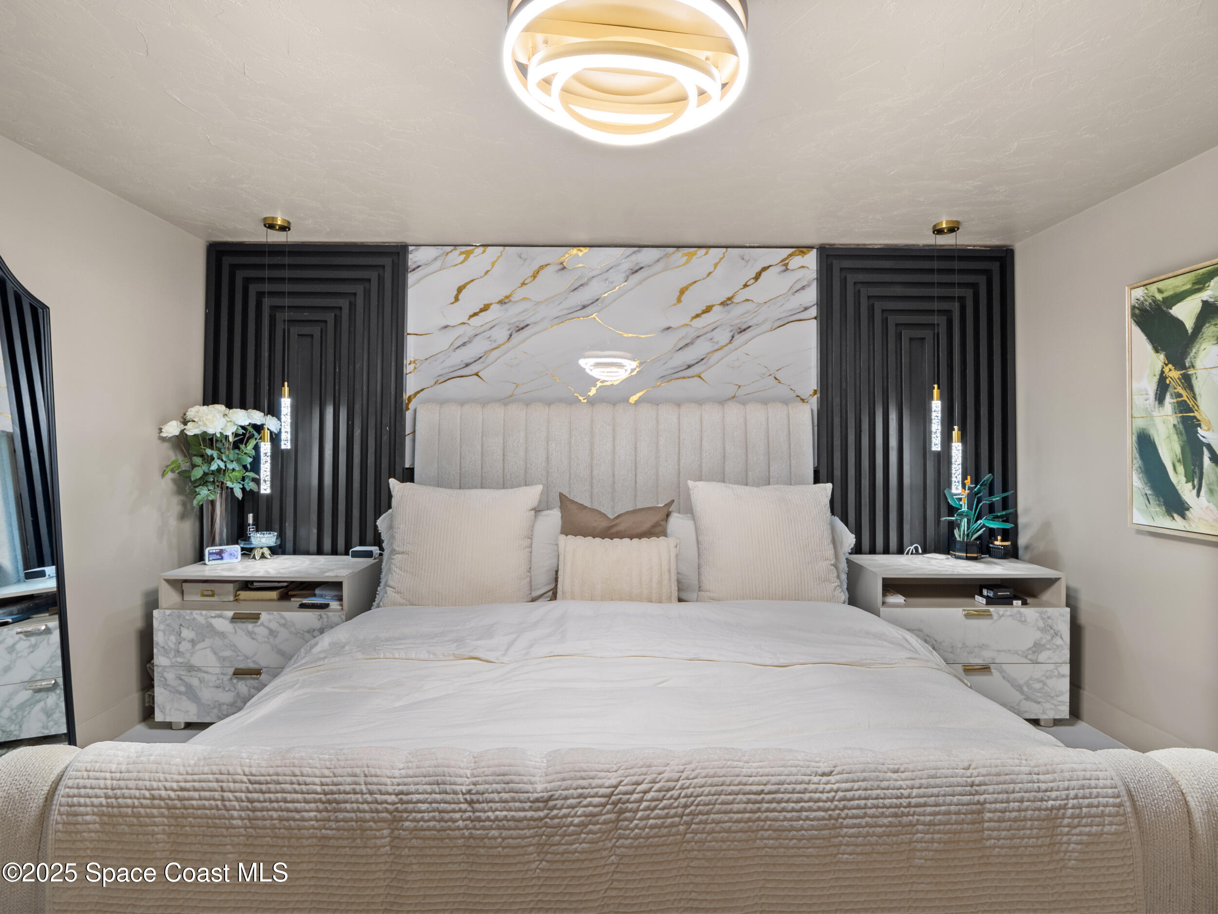 219 Sand Pine Road Indialantic, FL 32903 - Photo 18 of 38 a bedroom with a large bed and a window