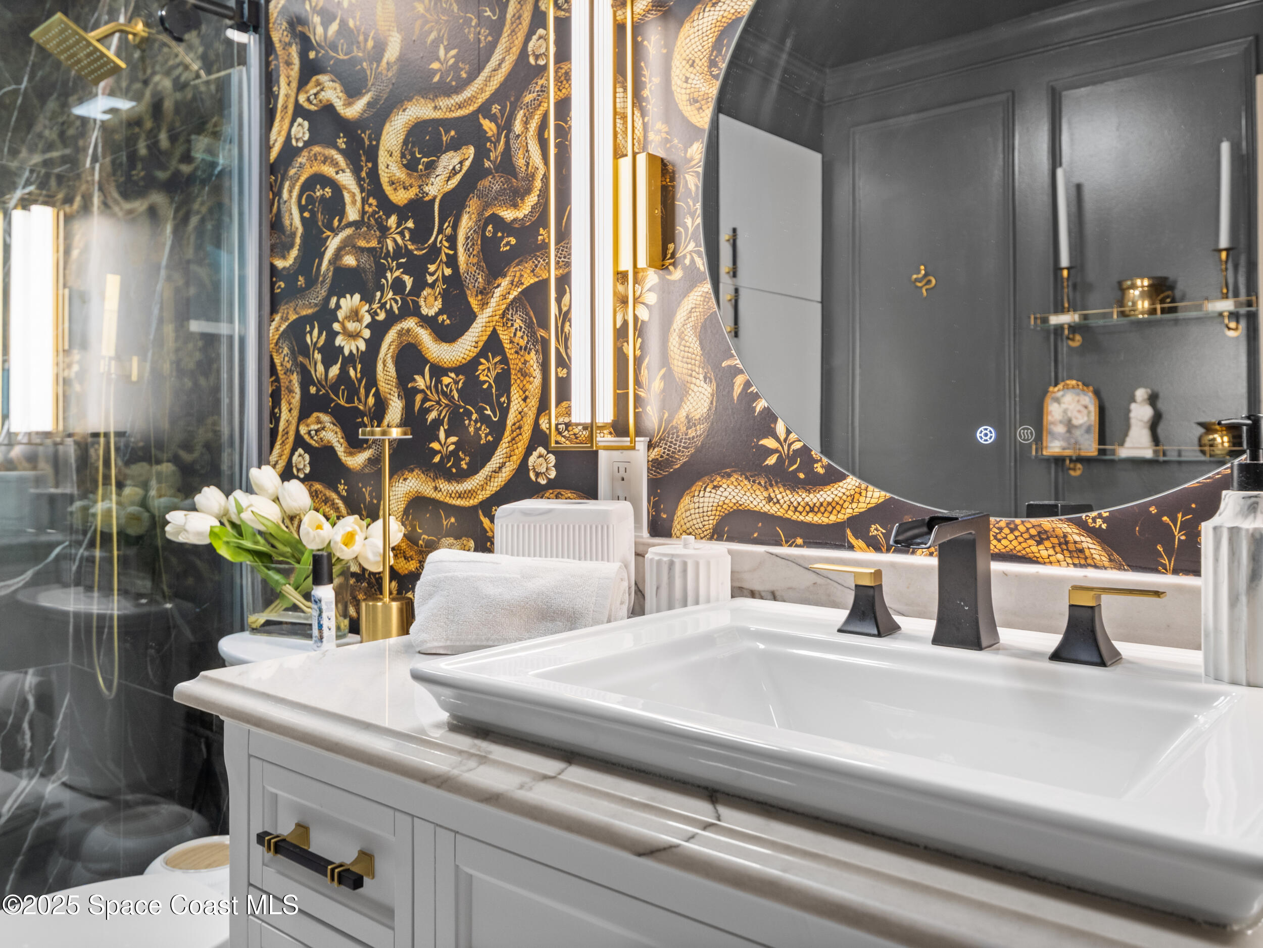 219 Sand Pine Road Indialantic, FL 32903 - Photo 22 of 38 a bathroom with a sink and a mirror