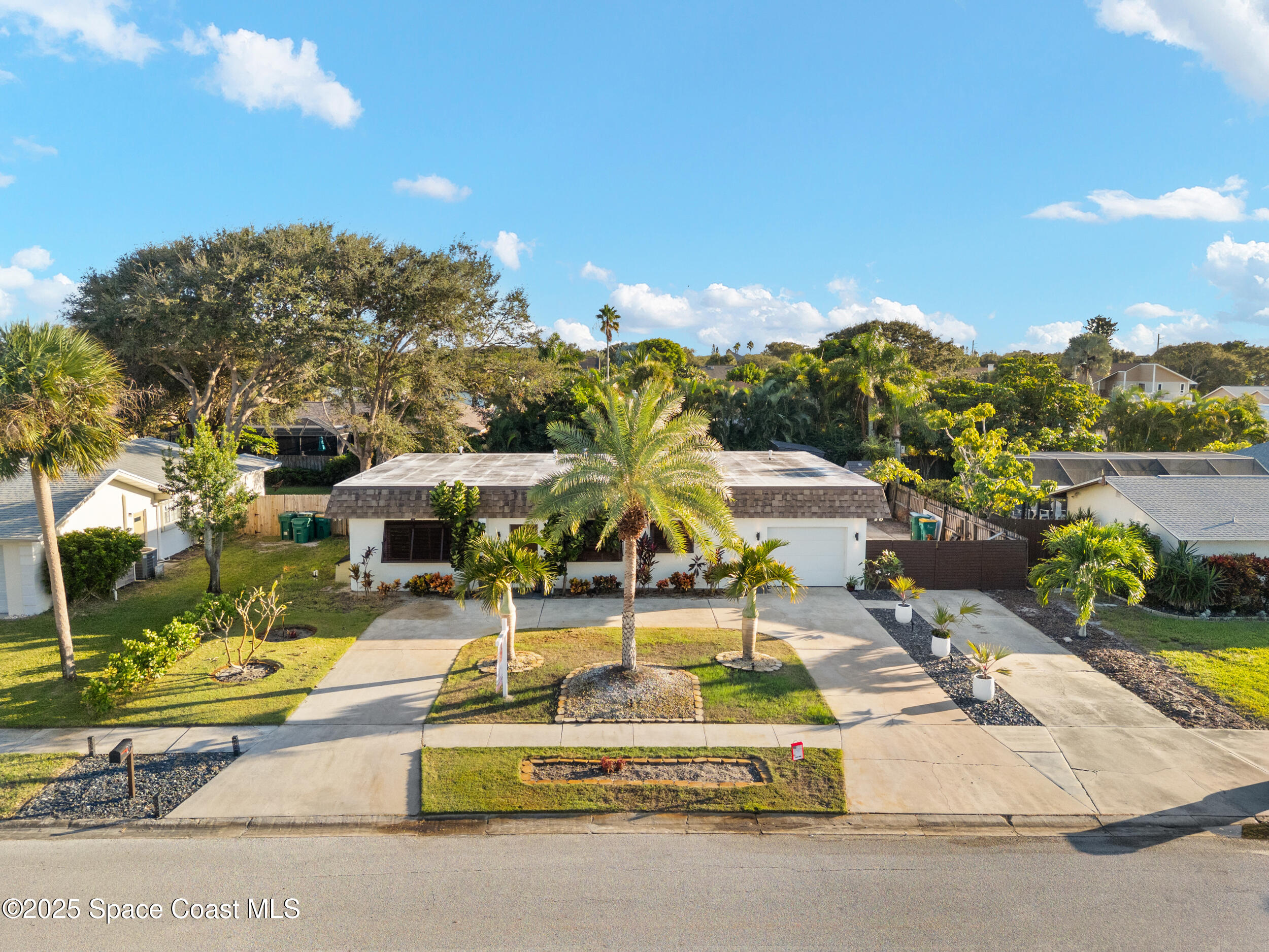 219 Sand Pine Road Indialantic, FL 32903 - Photo 29 of 38 a view of a swimming pool with a lounge chair