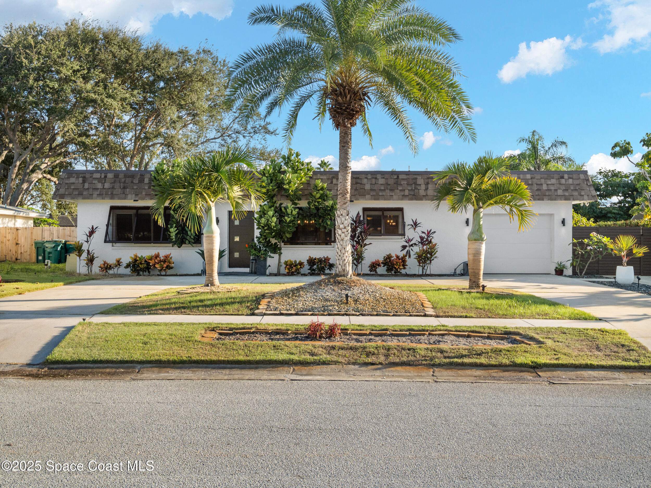219 Sand Pine Road Indialantic, FL 32903 - Photo 34 of 38 a view of a house with swimming pool and sitting area
