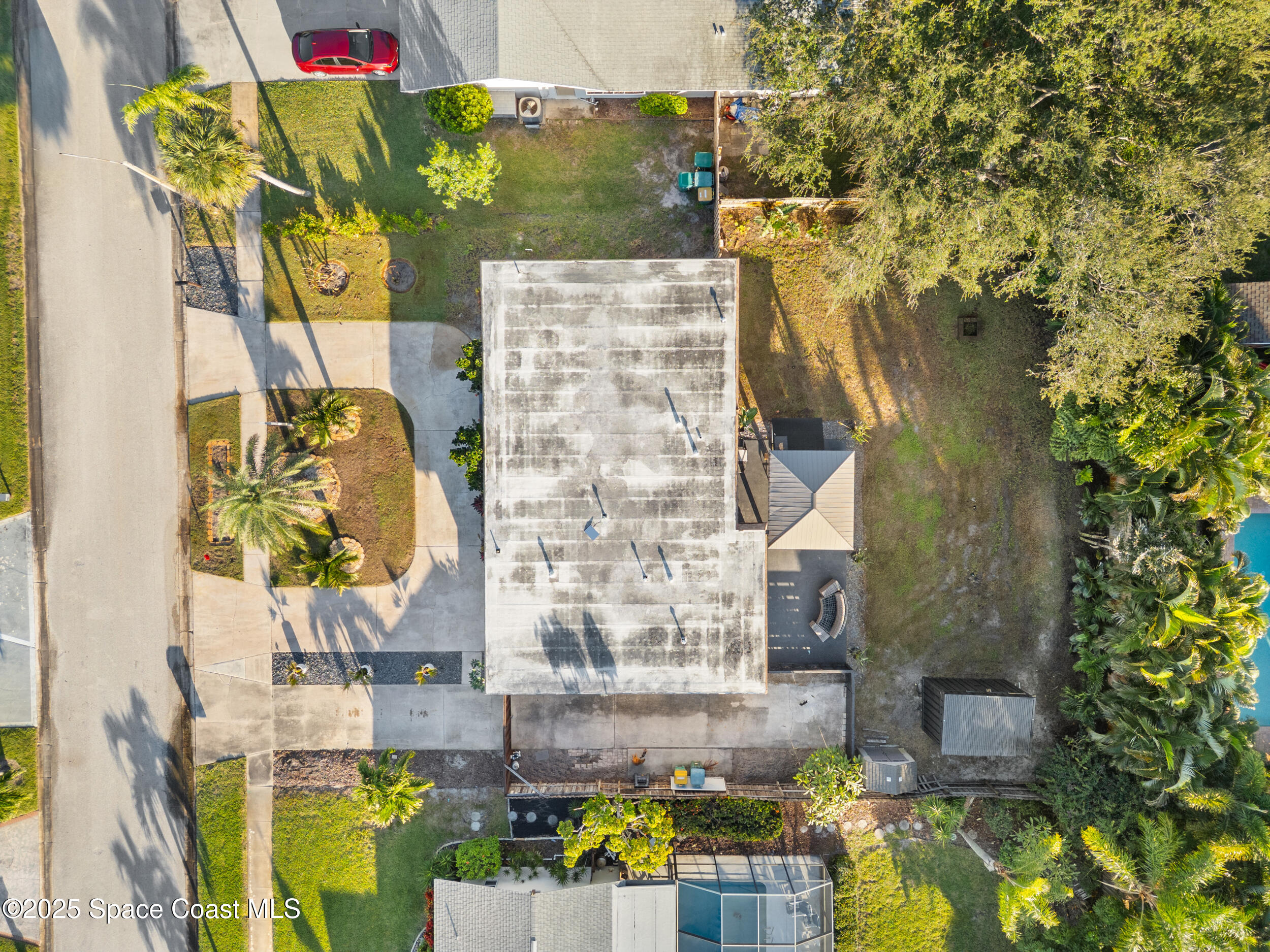 219 Sand Pine Road Indialantic, FL 32903 - Photo 35 of 38 a view of building along with trees