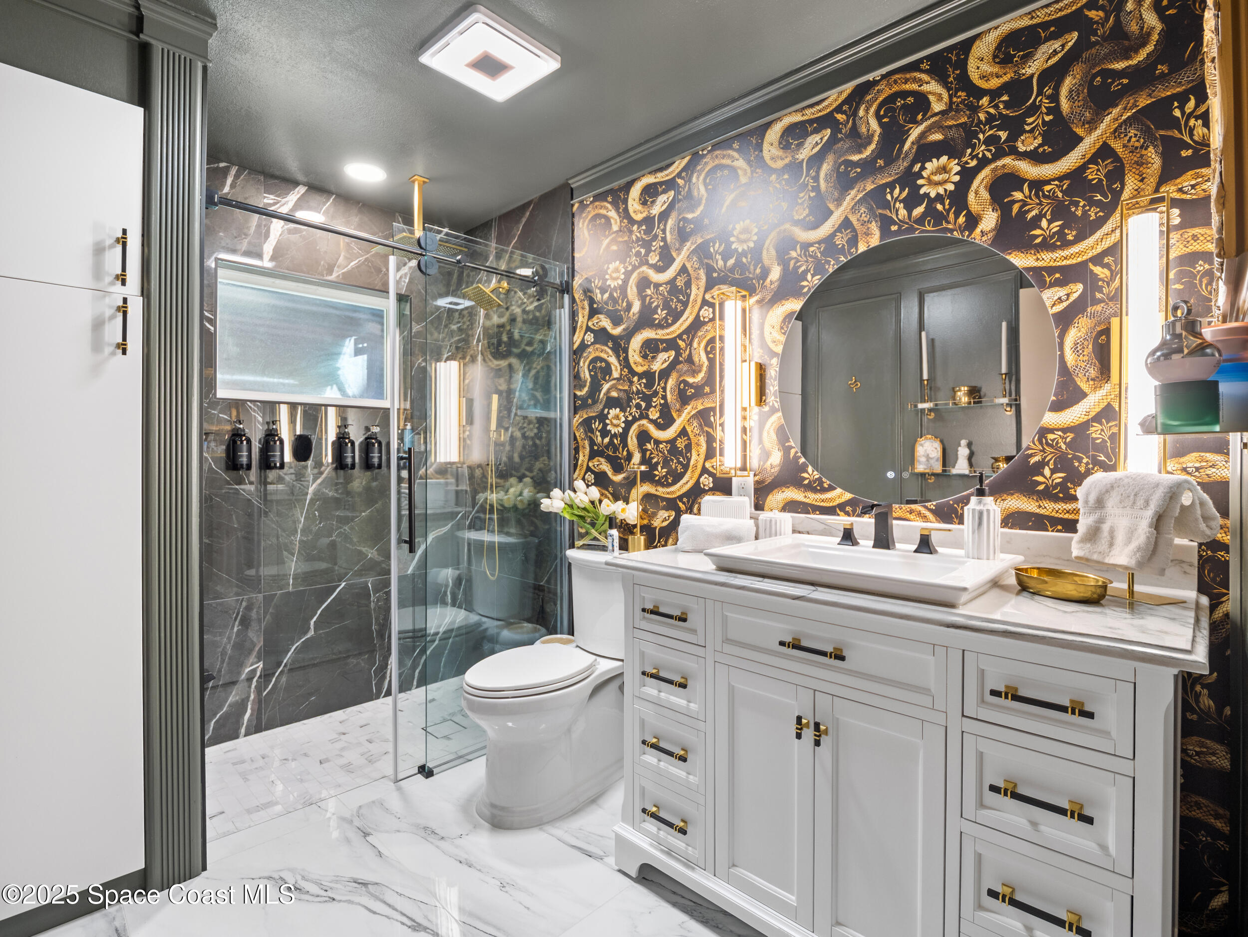 219 Sand Pine Road Indialantic, FL 32903 - Photo 4 of 38 a bathroom with a sink toilet and shower