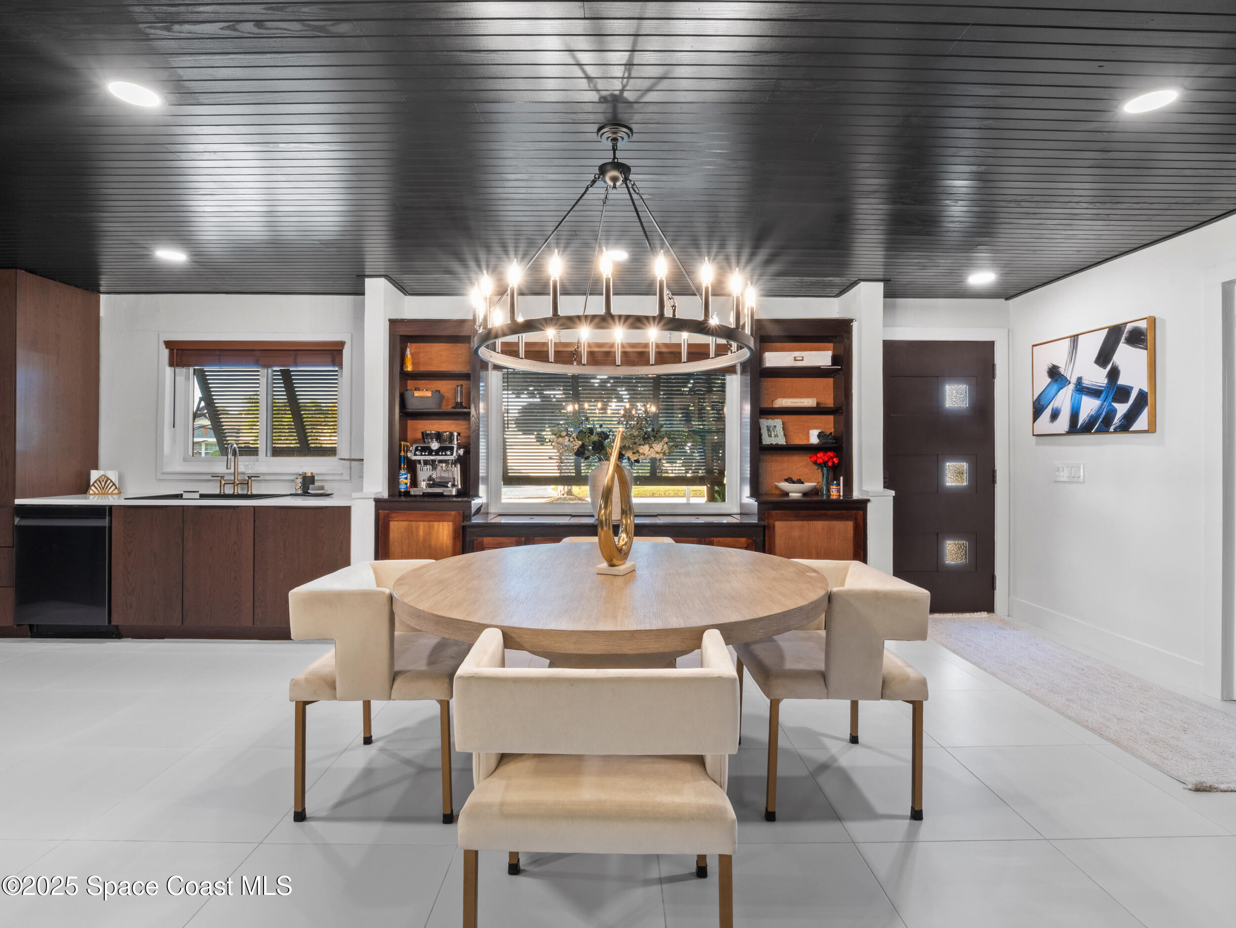 219 Sand Pine Road Indialantic, FL 32903 - Photo 10 of 38 a view of a dining room with furniture