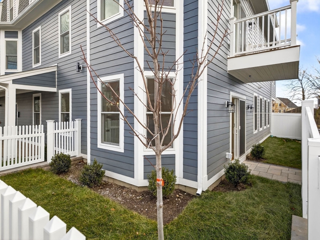 60 Stanley Street, Unit 102 Boston, MA 02125 - Photo 15 of 15 front view of a house with a yard
