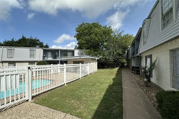 a front view of a house with a trees