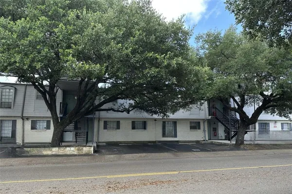 a kitchen with stainless steel appliances granite countertop a stove a refrigerator and a sink