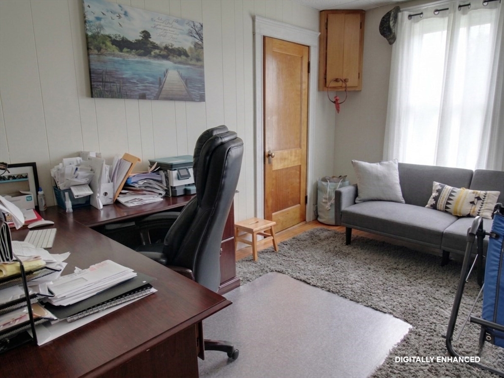35 Windham Street Worcester, MA 01610 - Photo 11 of 39 a living room with furniture and a window