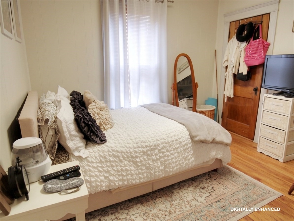 35 Windham Street Worcester, MA 01610 - Photo 13 of 39 a bed sitting in a bedroom next to a window