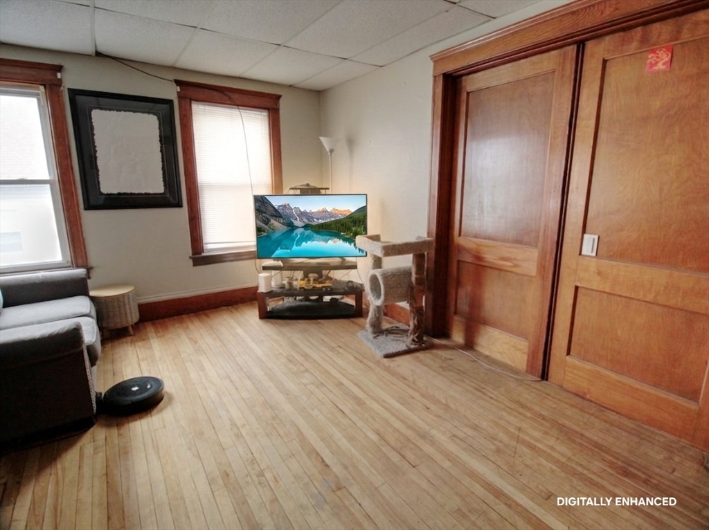 35 Windham Street Worcester, MA 01610 - Photo 19 of 39 a living room with furniture and a flat screen tv