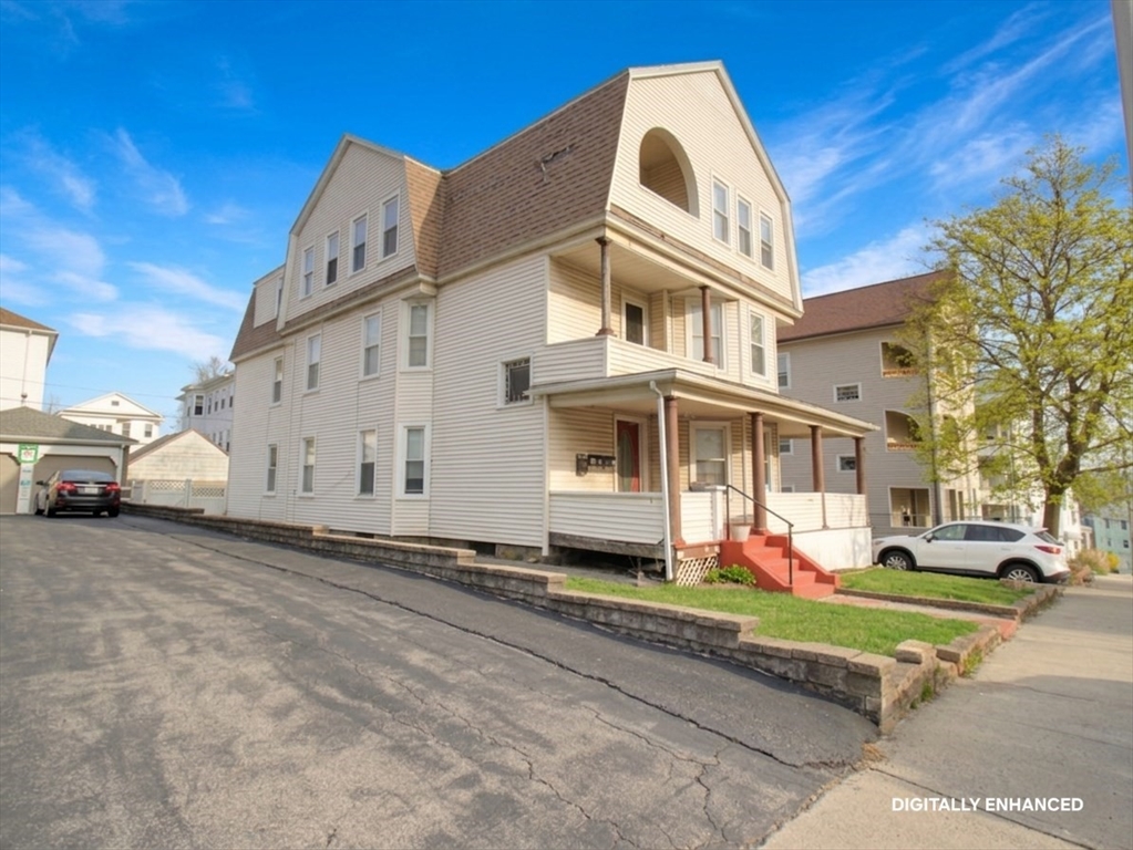35 Windham Street Worcester, MA 01610 - Photo 2 of 39 a view of a white building with a yard