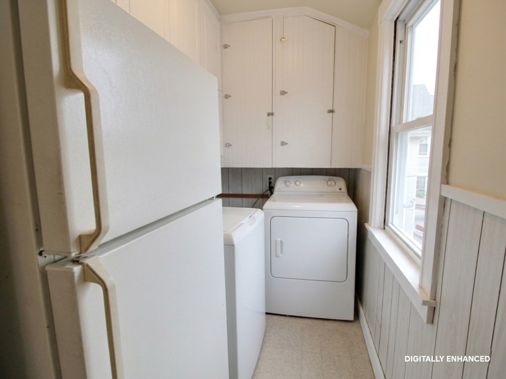 35 Windham Street Worcester, MA 01610 - Photo 22 of 39 a utility room with dryer and washer
