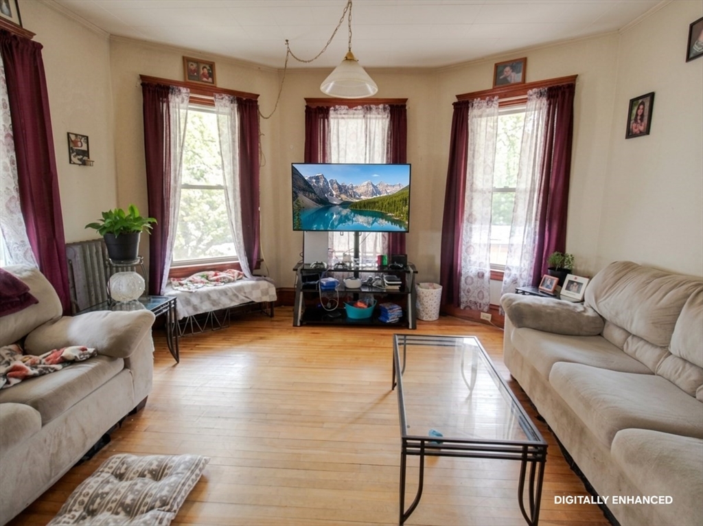 35 Windham Street Worcester, MA 01610 - Photo 23 of 39 a living room with furniture and a window