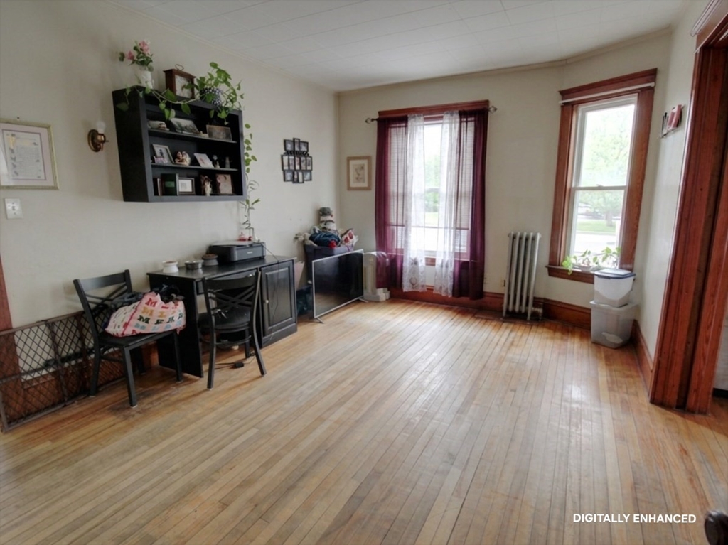 35 Windham Street Worcester, MA 01610 - Photo 25 of 39 a living room with furniture and a wooden floor