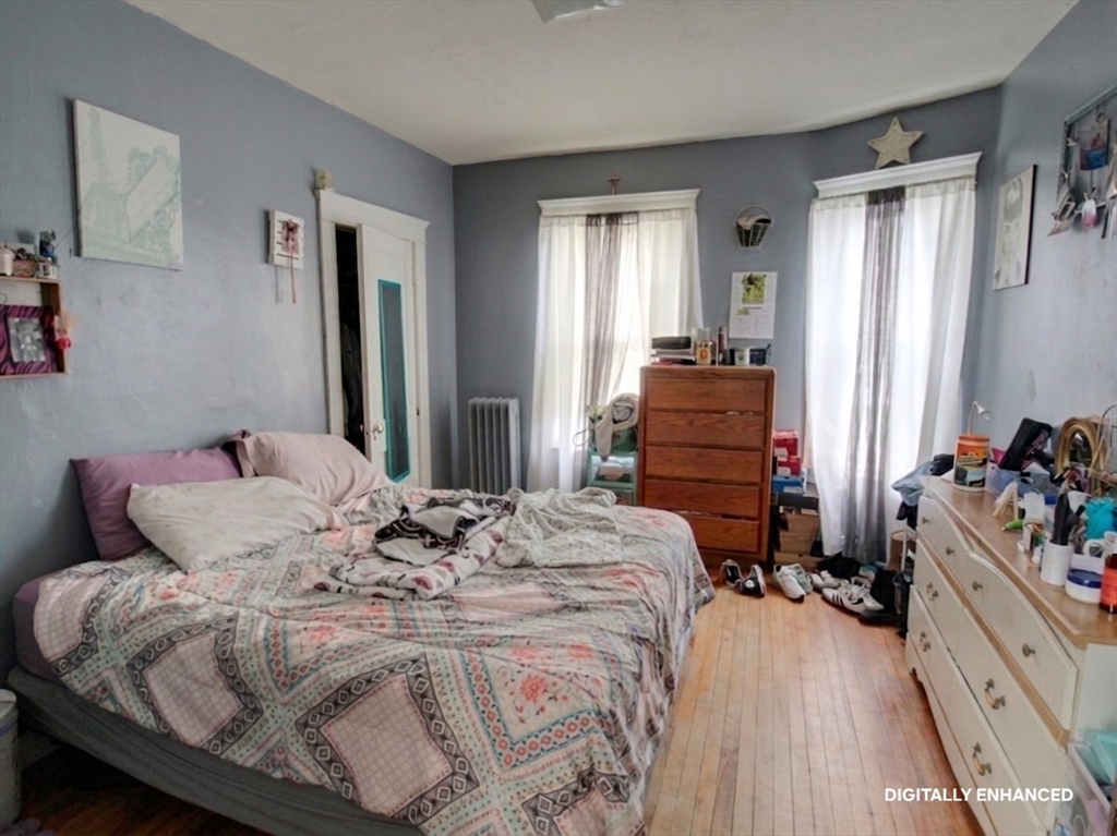 35 Windham Street Worcester, MA 01610 - Photo 27 of 39 a bedroom with a bed and a dresser
