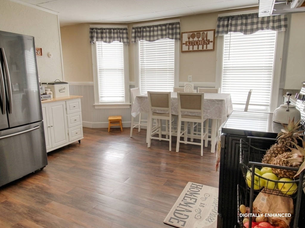 35 Windham Street Worcester, MA 01610 - Photo 5 of 39 a dining room with furniture and wooden floor