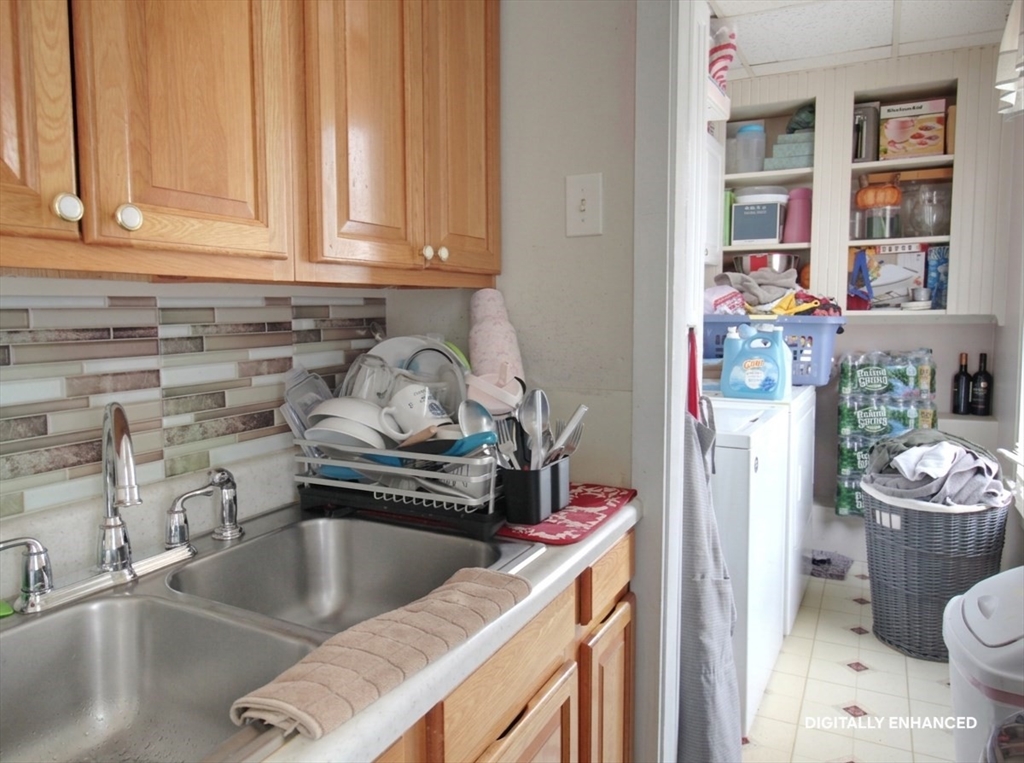 35 Windham Street Worcester, MA 01610 - Photo 6 of 39 a kitchen with a sink stove and cabinets