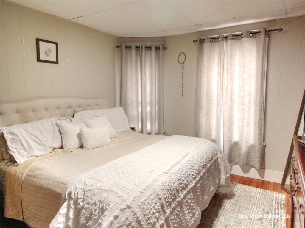 35 Windham Street Worcester, MA 01610 - Photo 10 of 39 a bedroom with a bed and a window