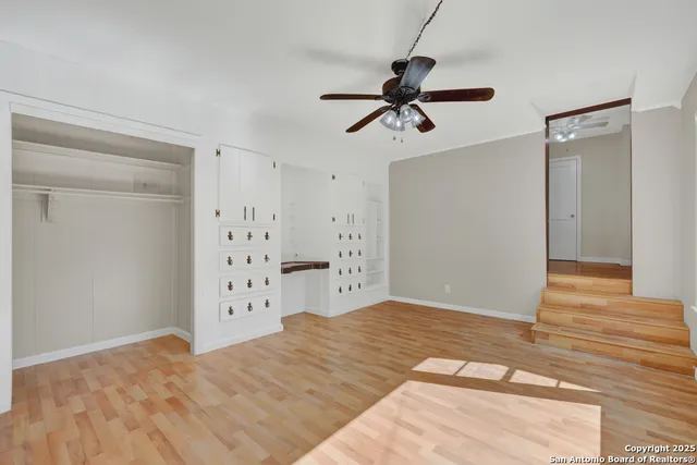 a view of a bedroom with closet and window