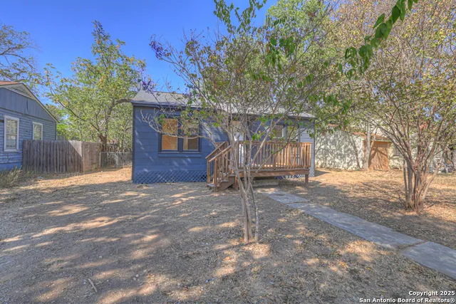 a view of a house with a tree