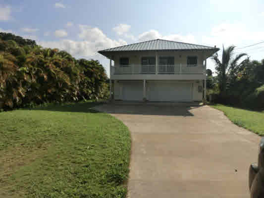 1736 Hulu Road, Unit 2 Kapaa, HI 96746 - Photo 1 of 12 a front view of a house with garden