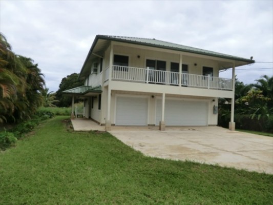 1736 Hulu Road, Unit 2 Kapaa, HI 96746 - Photo 2 of 12 a front view of a house with a garden