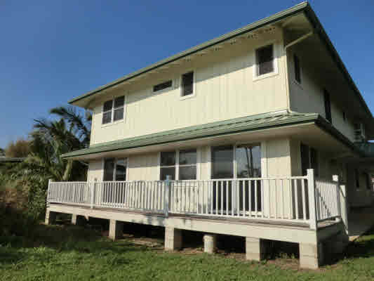 1736 Hulu Road, Unit 2 Kapaa, HI 96746 - Photo 3 of 12 a front view of a house with a yard