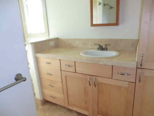 1736 Hulu Road, Unit 2 Kapaa, HI 96746 - Photo 8 of 12 a bathroom with a sink and a mirror
