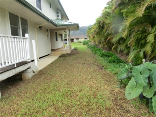 1736 Hulu Road, Unit 2 Kapaa, HI 96746 - Photo 10 of 12 a view of a house with a backyard and balcony