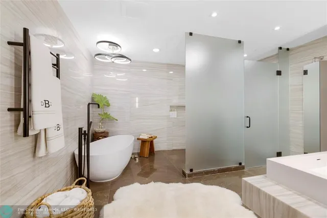 a bathroom with a toilet a sink and a shower curtain