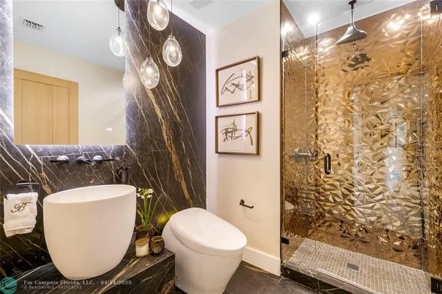 a bedroom with bed and a chandelier