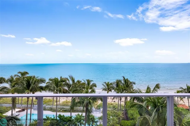 a bedroom with furniture and a large window