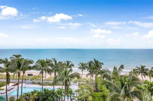 a living room with furniture a rug and a flat screen tv