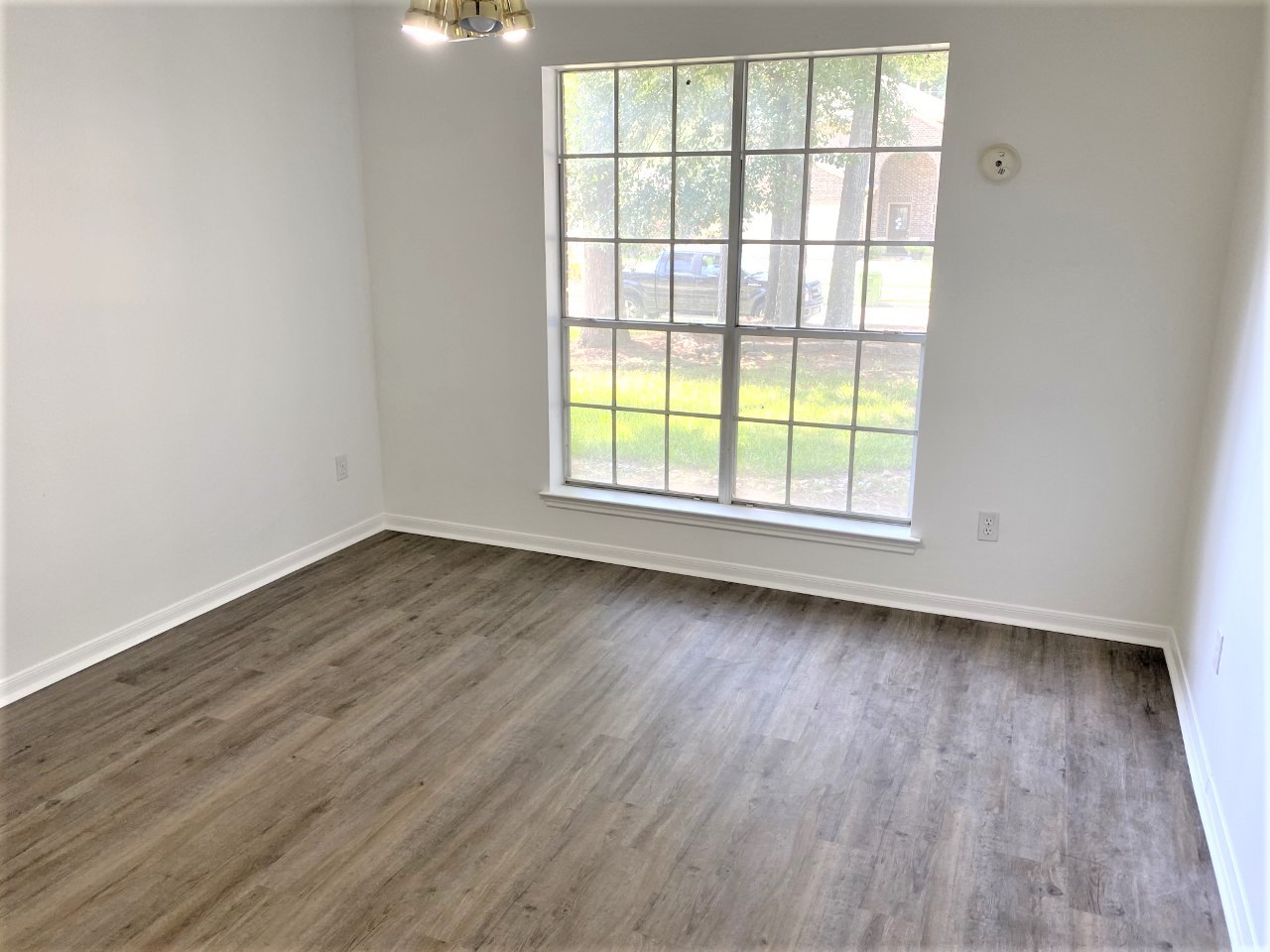 3011 Pheasant Run Humble, TX 77396 - Photo 12 of 17 an empty room with wooden floor and windows