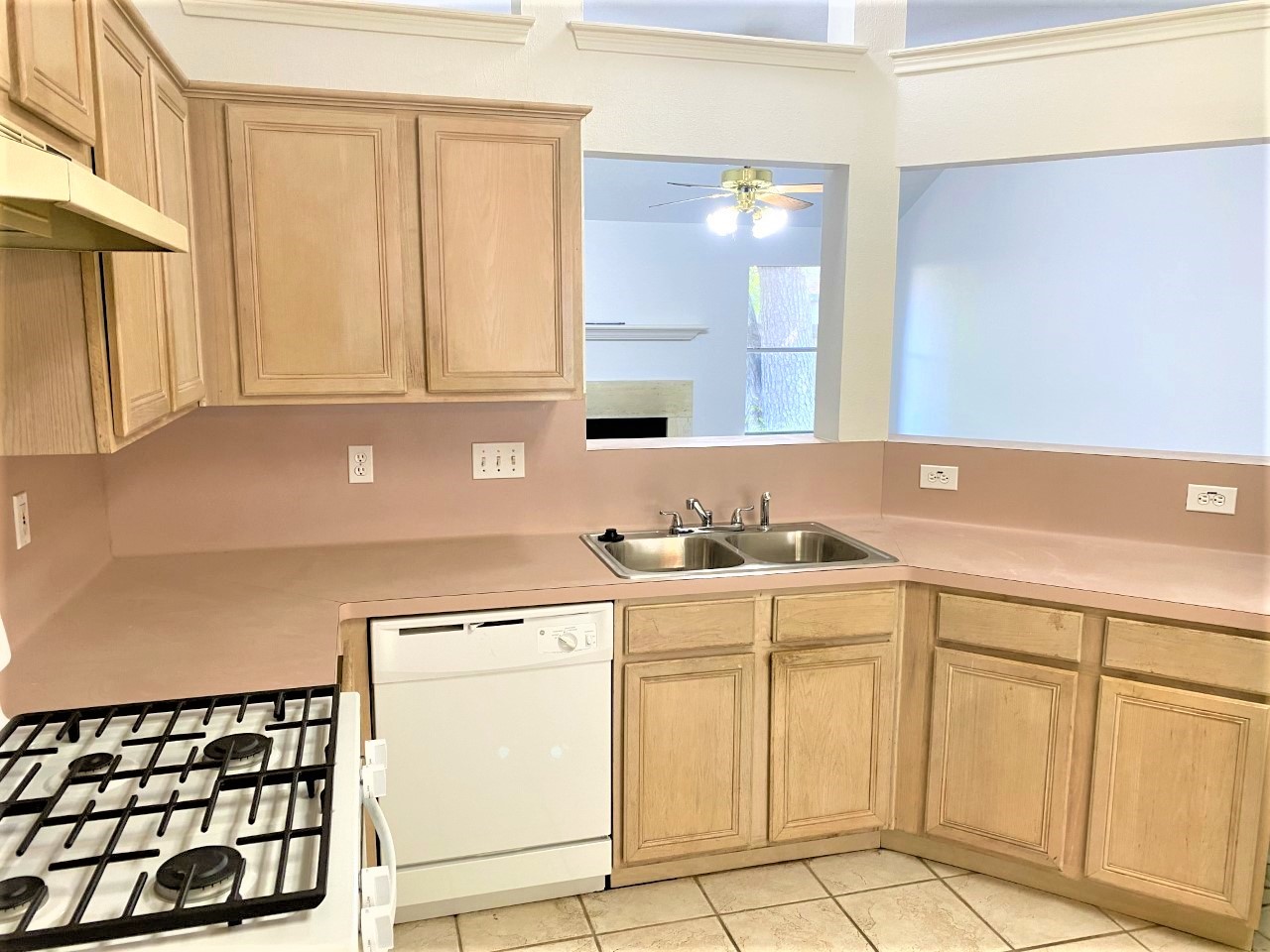 3011 Pheasant Run Humble, TX 77396 - Photo 3 of 17 a kitchen with a sink cabinets and window