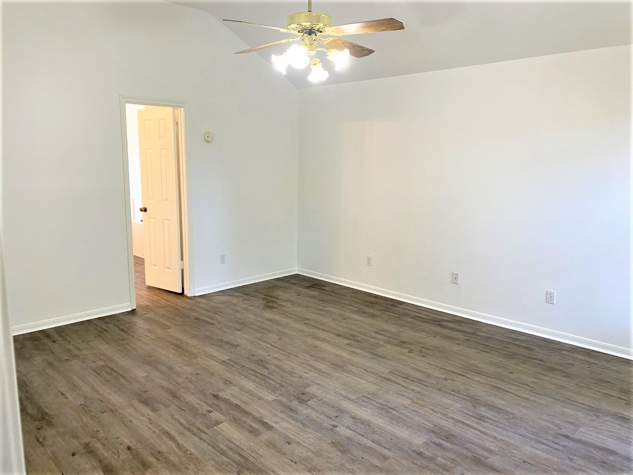 3011 Pheasant Run Humble, TX 77396 - Photo 8 of 17 a view of empty room with wooden floor and fan