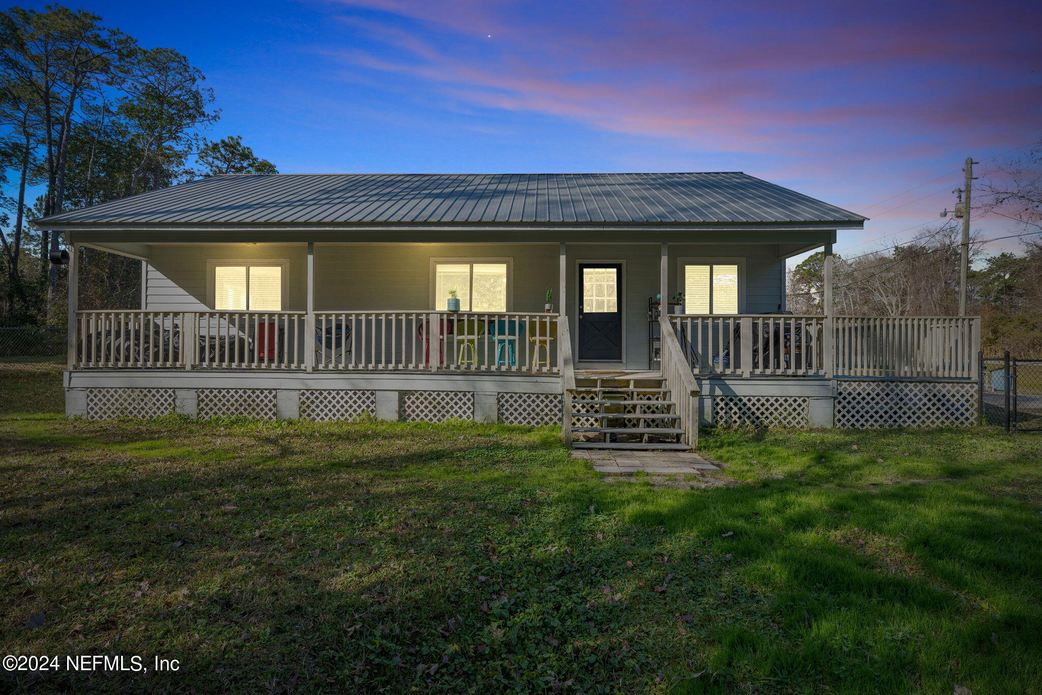 a view of a house with a yard and deck