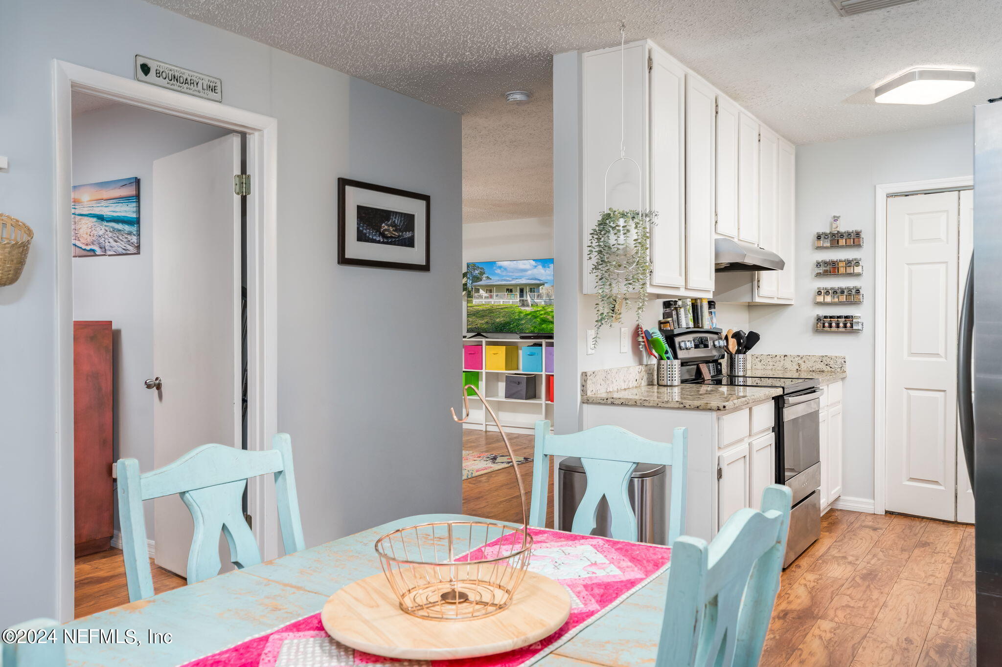 320 Katnack Road St. Augustine, FL 32095 - Photo 10 of 33 a living room with stainless steel appliances furniture a rug and a dining table
