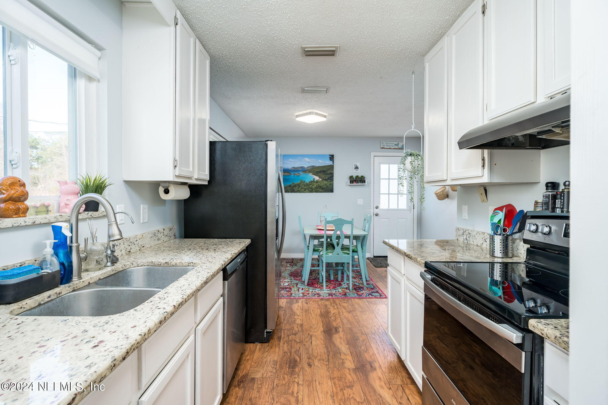 320 Katnack Road St. Augustine, FL 32095 - Photo 12 of 33 a kitchen with granite countertop lots of counter top space and stainless steel appliances