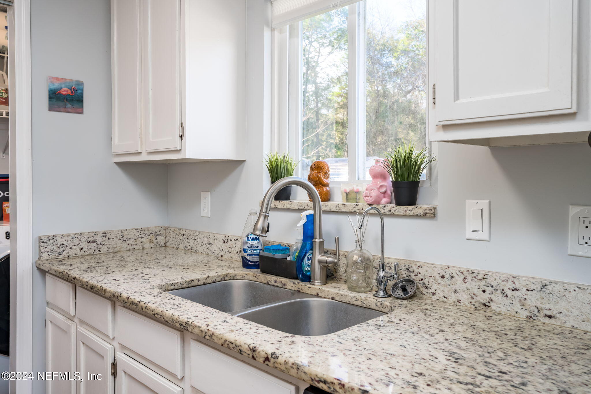320 Katnack Road St. Augustine, FL 32095 - Photo 13 of 33 a kitchen with granite countertop a sink and a window