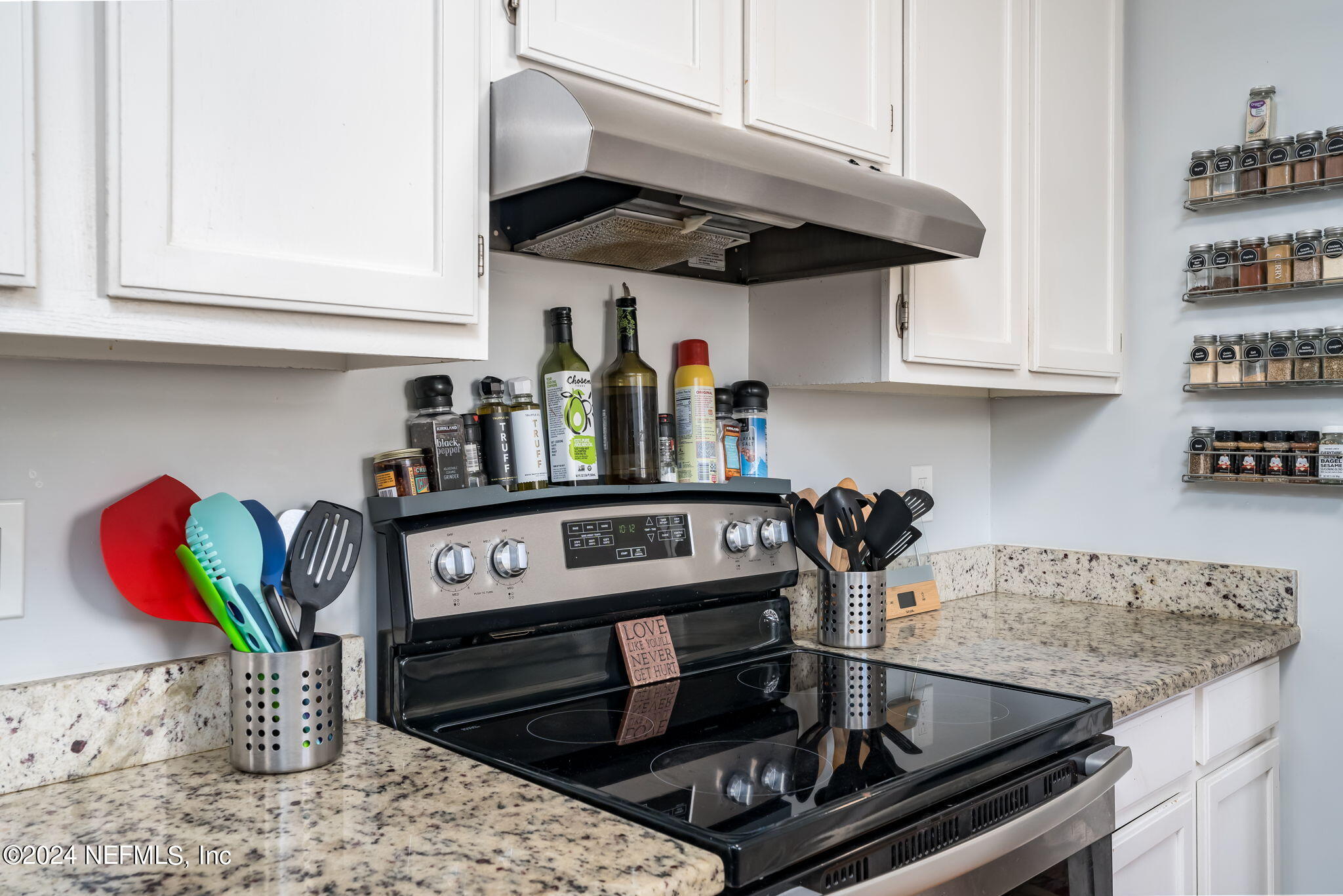 320 Katnack Road St. Augustine, FL 32095 - Photo 14 of 33 a kitchen with stainless steel appliances granite countertop a sink stove and cabinets