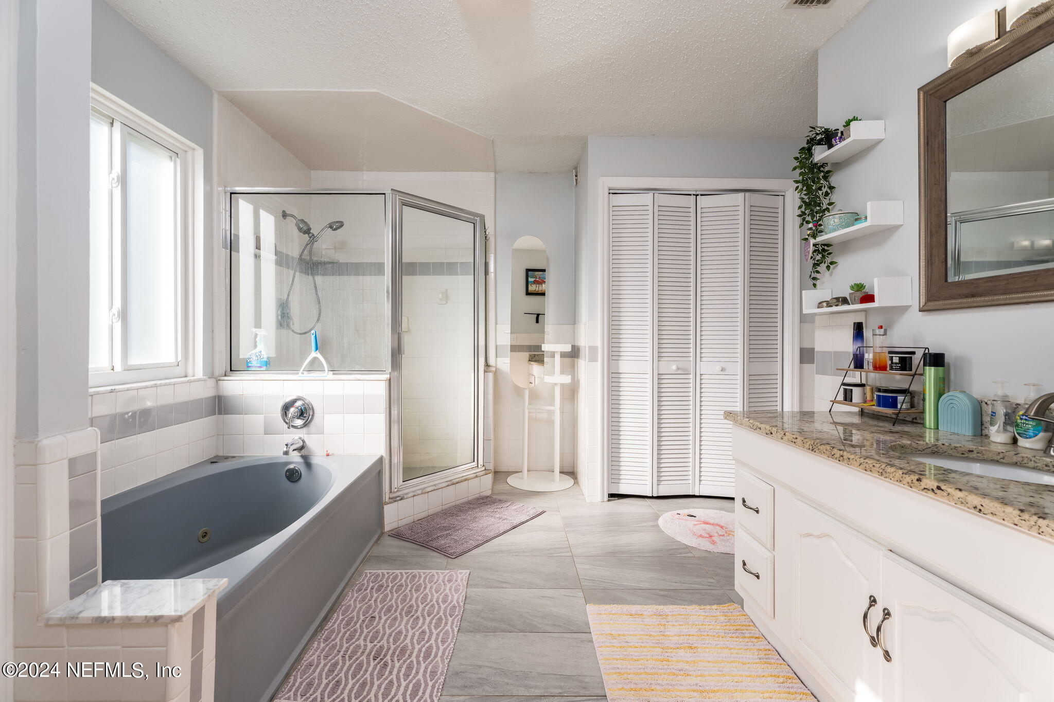 320 Katnack Road St. Augustine, FL 32095 - Photo 19 of 33 a large spacious bathroom with a granite countertop tub shower and sink