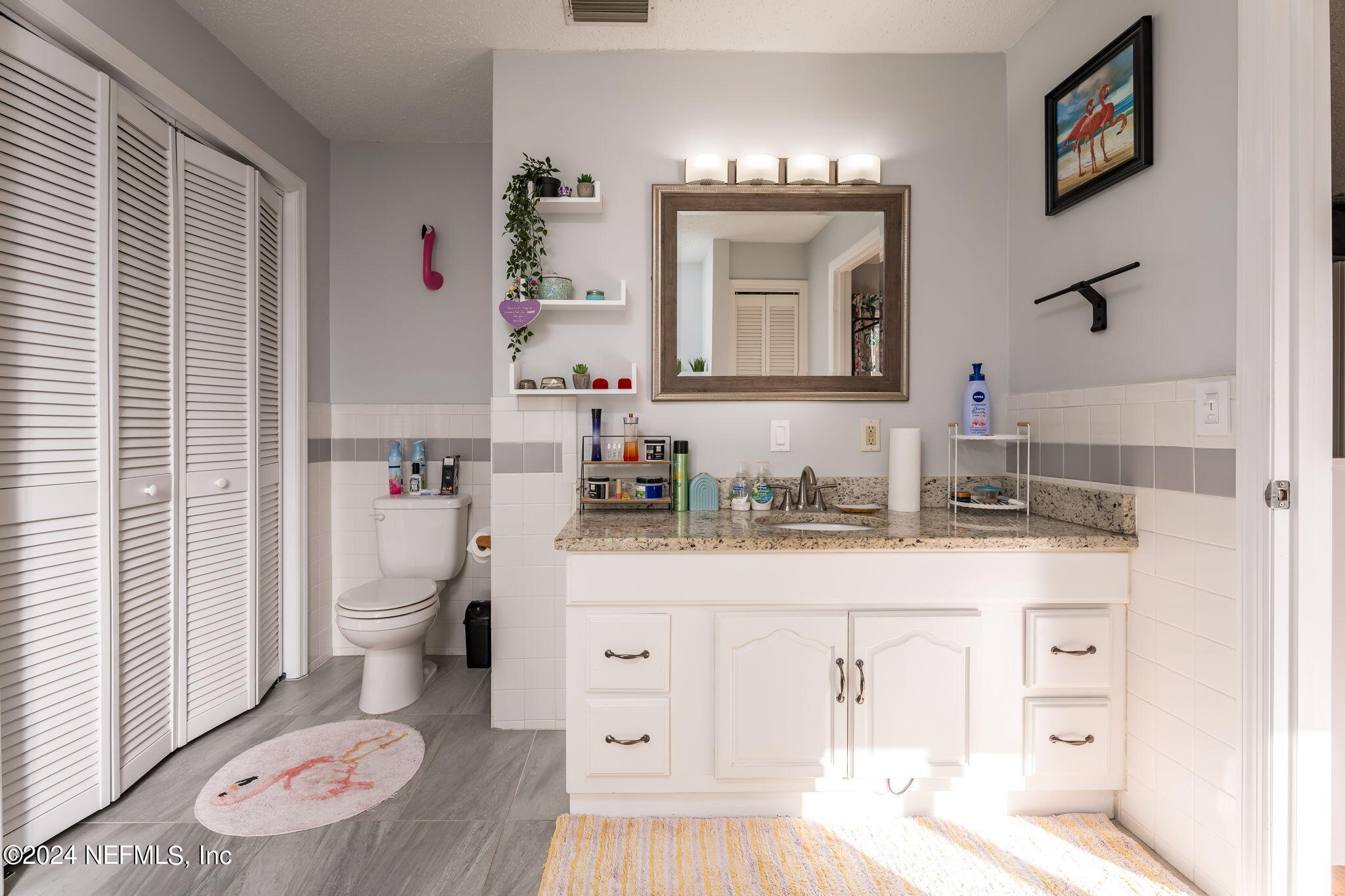 320 Katnack Road St. Augustine, FL 32095 - Photo 21 of 33 a bathroom with a sink a toilet and a mirror