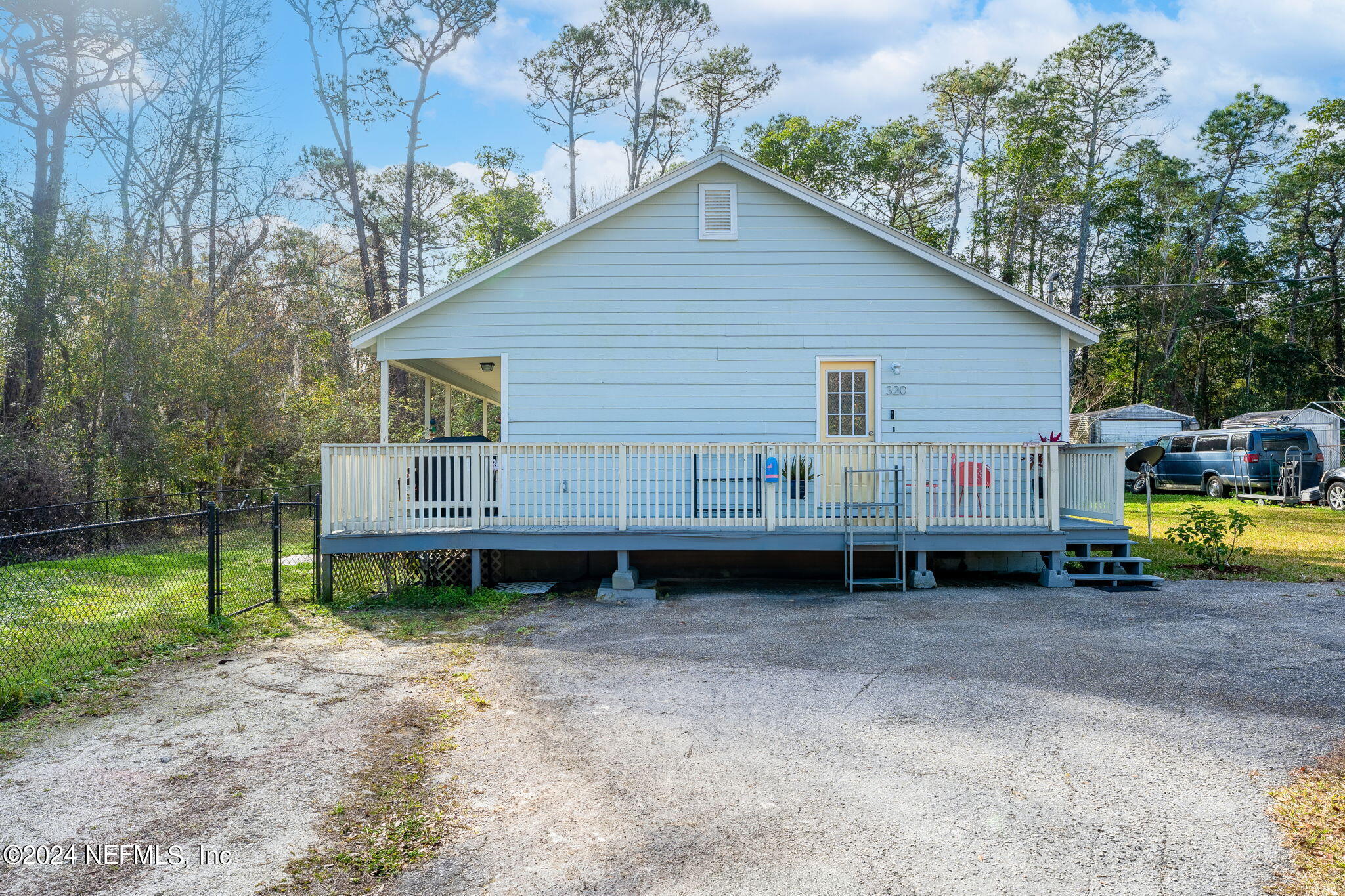 320 Katnack Road St. Augustine, FL 32095 - Photo 25 of 33 a backyard of a house with barbeque oven and table